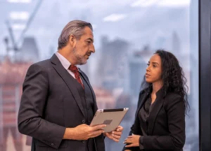 A lawyer consulting with a client across a desk