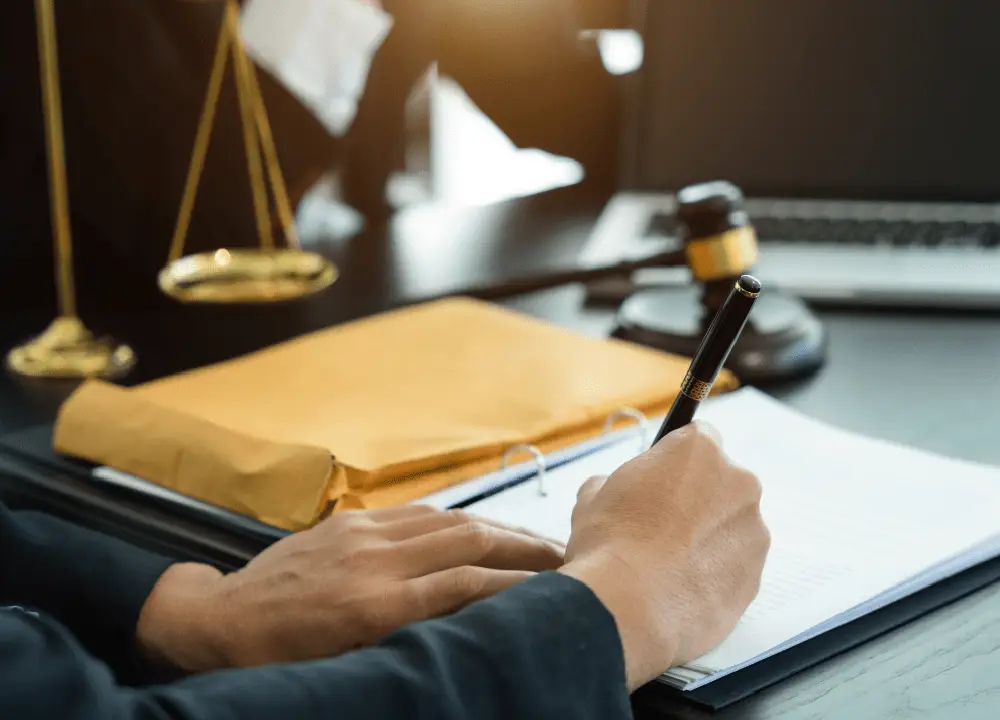 Texas lawyer in an office setting with gavel and paper in the table