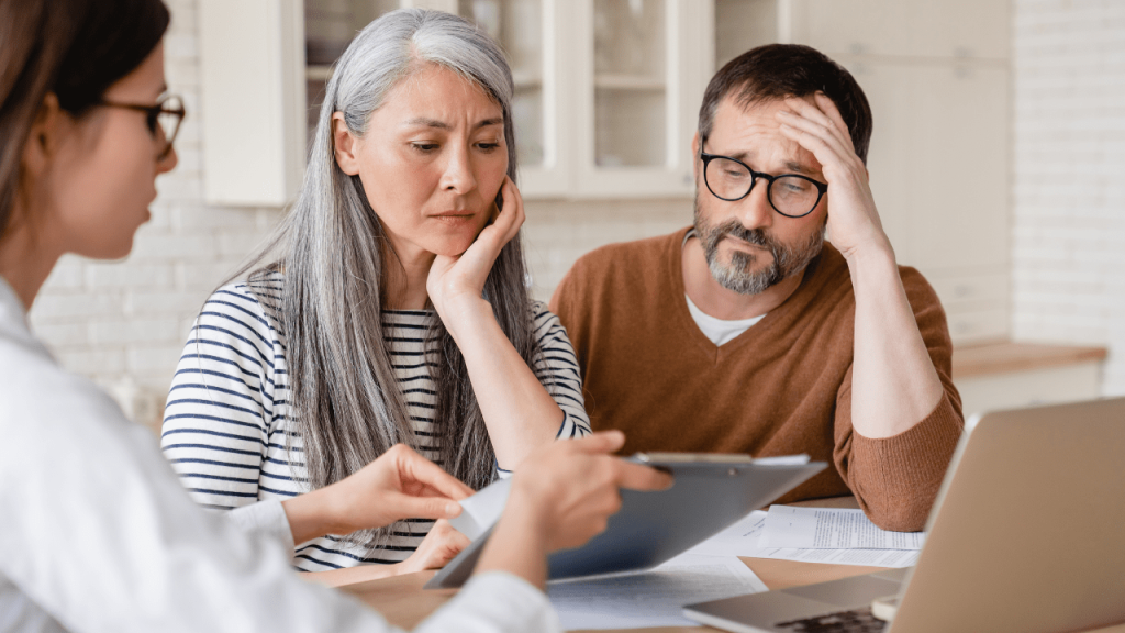 Family meeting with lawyer to discuss asbestos death compensation claim.