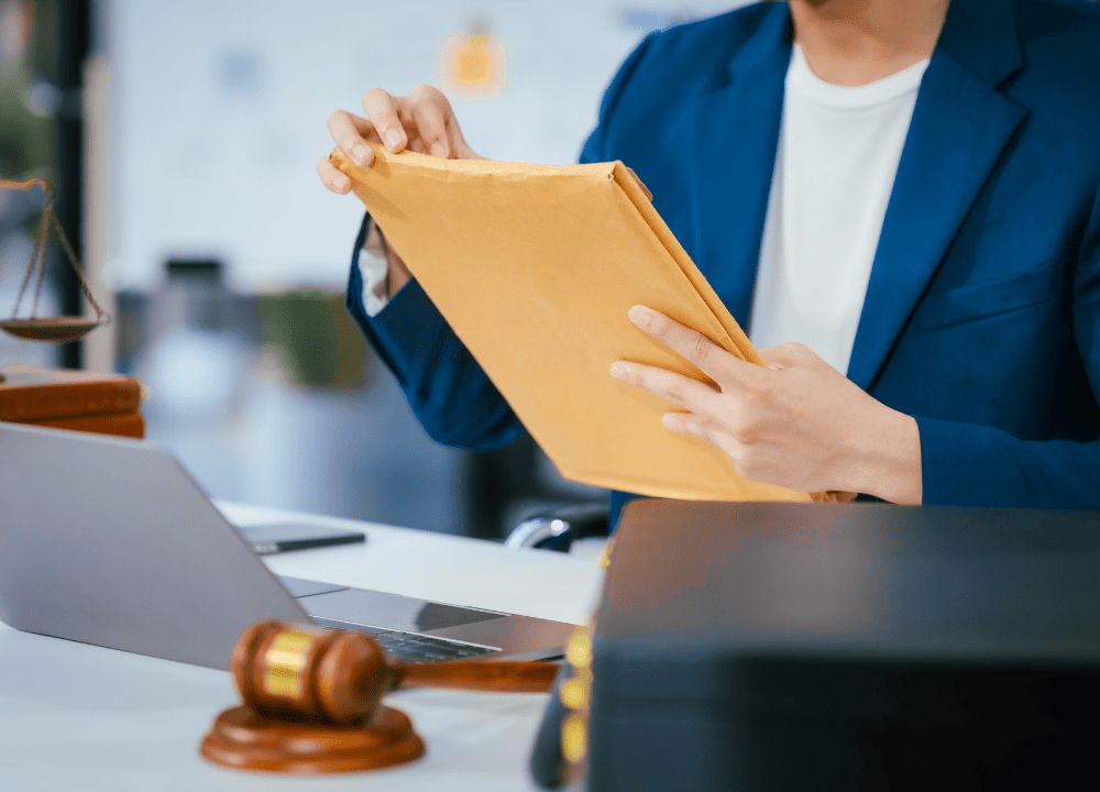 Lawyer reviewing asbestos wrongful death case evidence.