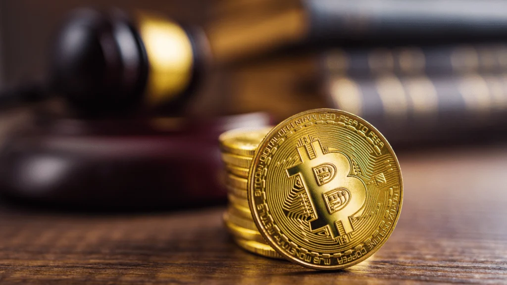 Gavel and bitcoin on legal document representing cryptocurrency recovery