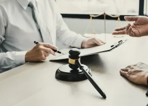 Asbestos attorney reviewing Shook & Fletcher trust claim documentation with client.