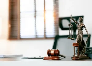 gavel, legal documents, and scales of justice representing asbestos litigation