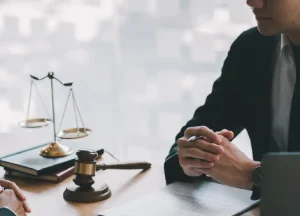 Asbestos Exposure in U.S. Navy Shipyards: The Hidden Risk Still Affecting Veterans 2 meeting with a lawyer to discuss legal and compensation options for asbestos exposure in shipyards