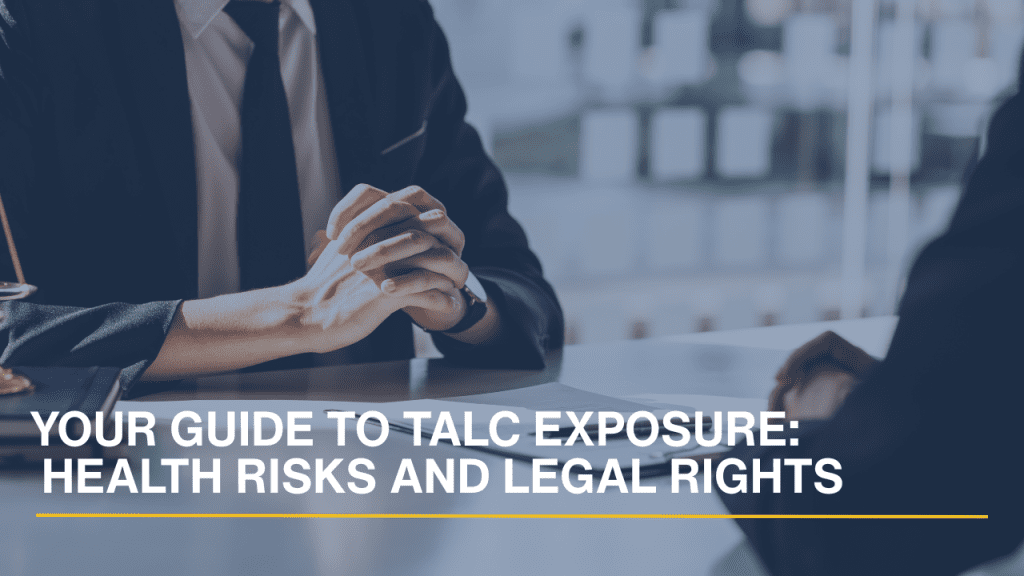 Lawyer consulting with a client while reviewing documents related to talc exposure and legal rights.