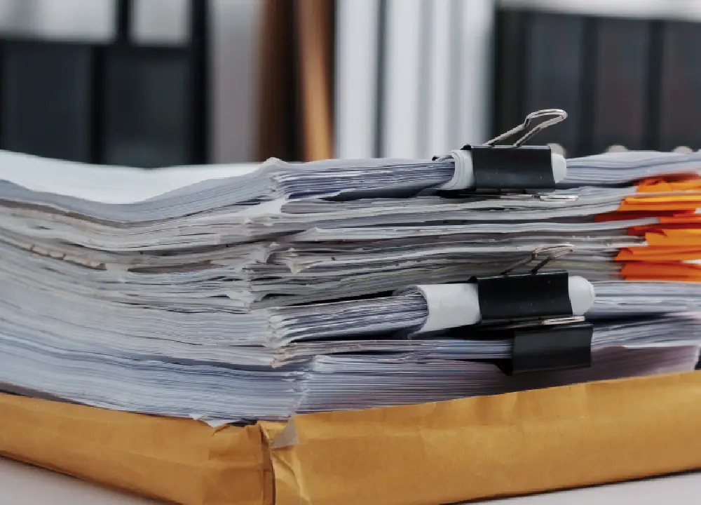 Claiming Compensation from Asbestos Bankruptcy Trust Funds: A Step-by-Step Guide 1 Stacked legal documents related to asbestos trust fund claims