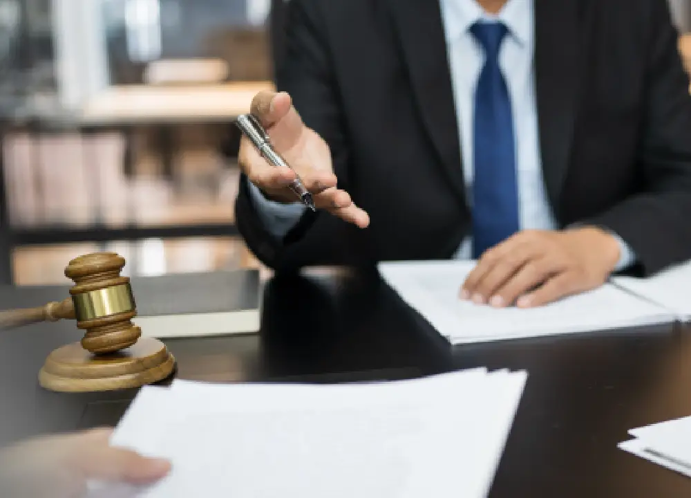 Key Steps After Your Mesothelioma Diagnosis 3 Attorney reviewing documents and discussing next steps in a legal consultation.