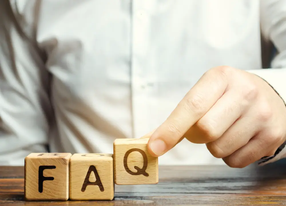 wooden blocks with the word FAQ 