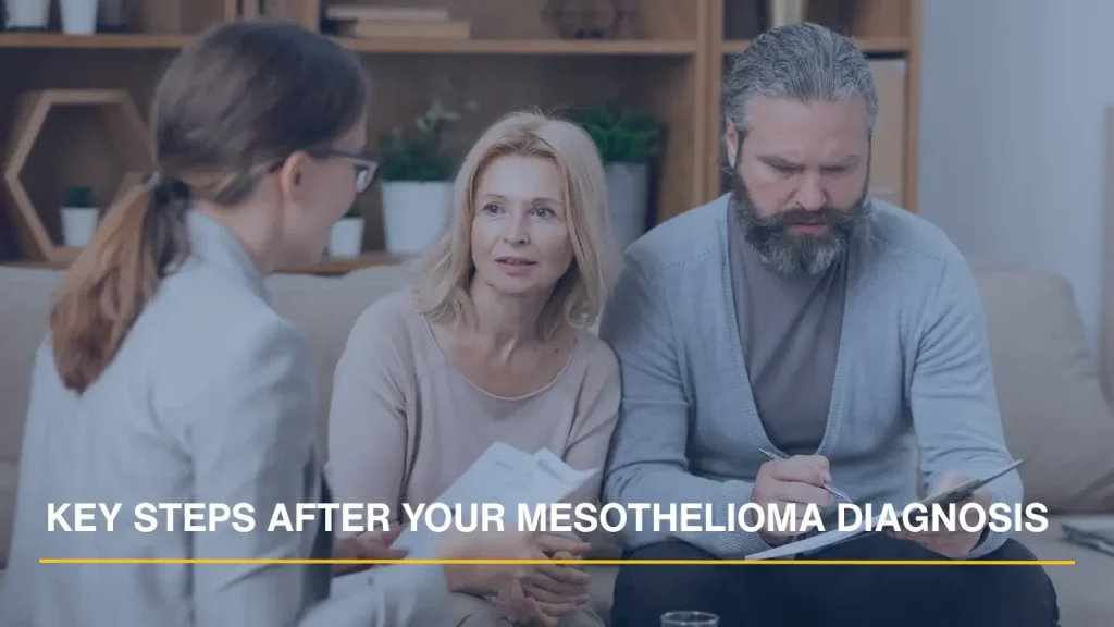 Couple meeting with a professional to discuss key steps after a mesothelioma diagnosis.