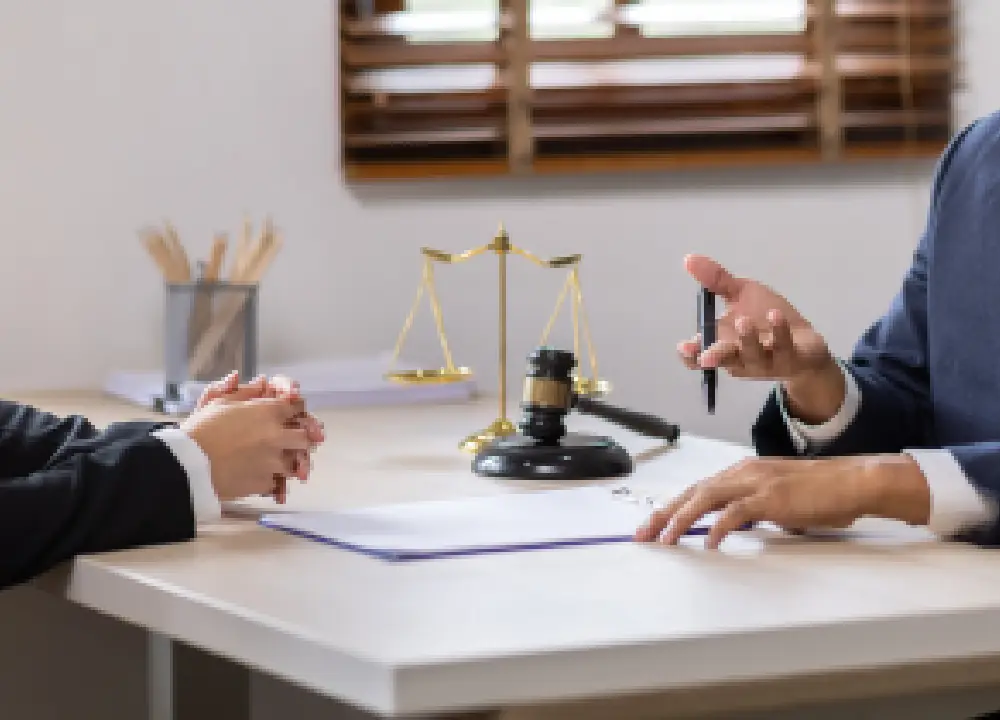 Mesothelioma 101: Symptoms, Causes, and Your Legal Options 3 Lawyer meeting with a client to discuss legal options