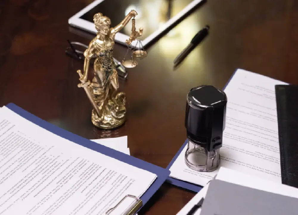 Close-up of legal documents with highlighted notes and annotations.