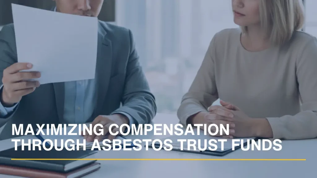 Attorney reviewing documents with a client to maximize asbestos trust fund compensation