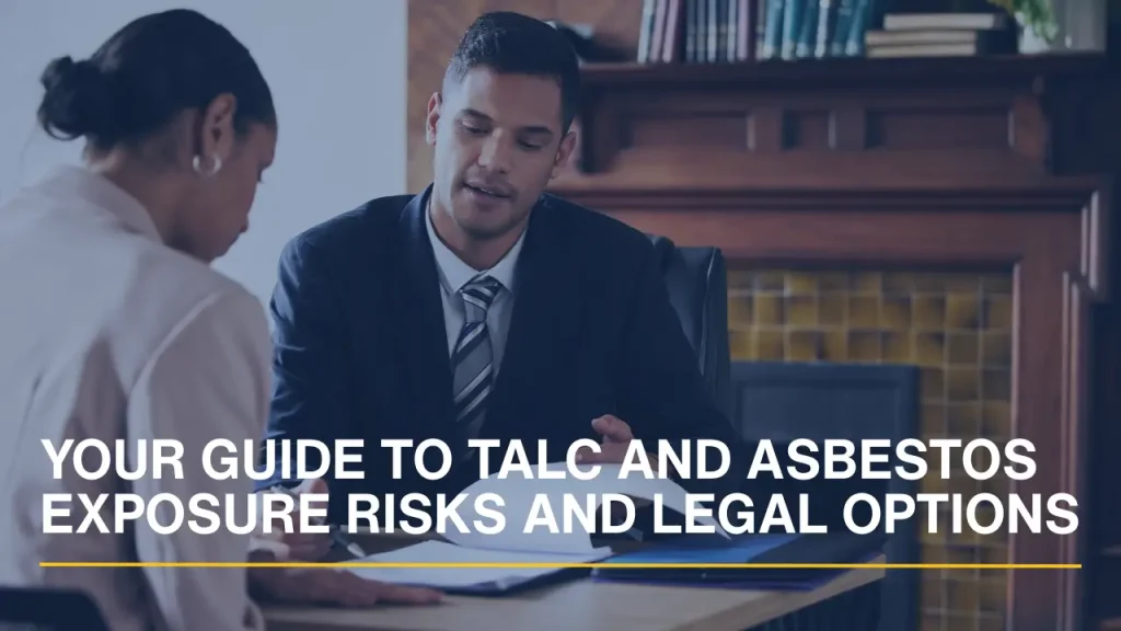 Lawyer consulting with a client while reviewing documents related to talc and asbestos exposure risks.