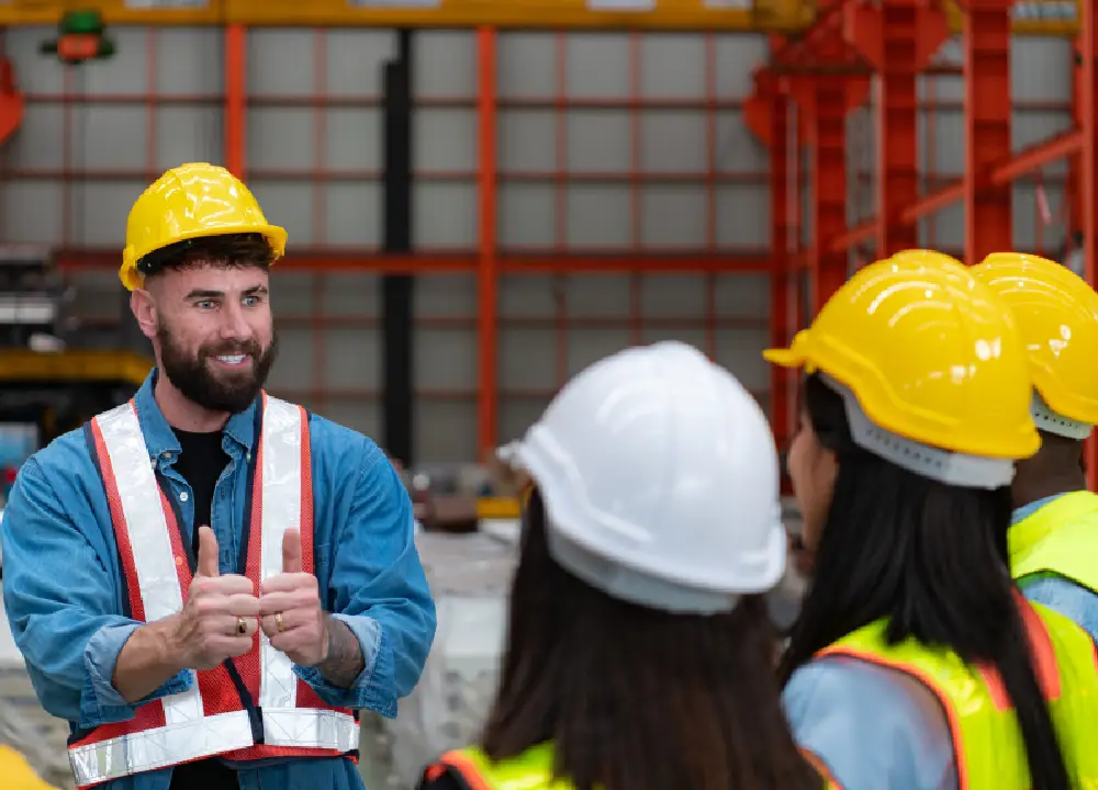 The Risks of Mesothelioma Cancer: What You Need to Know 3 Construction workers participating in workplace safety training while wearing protective equipment