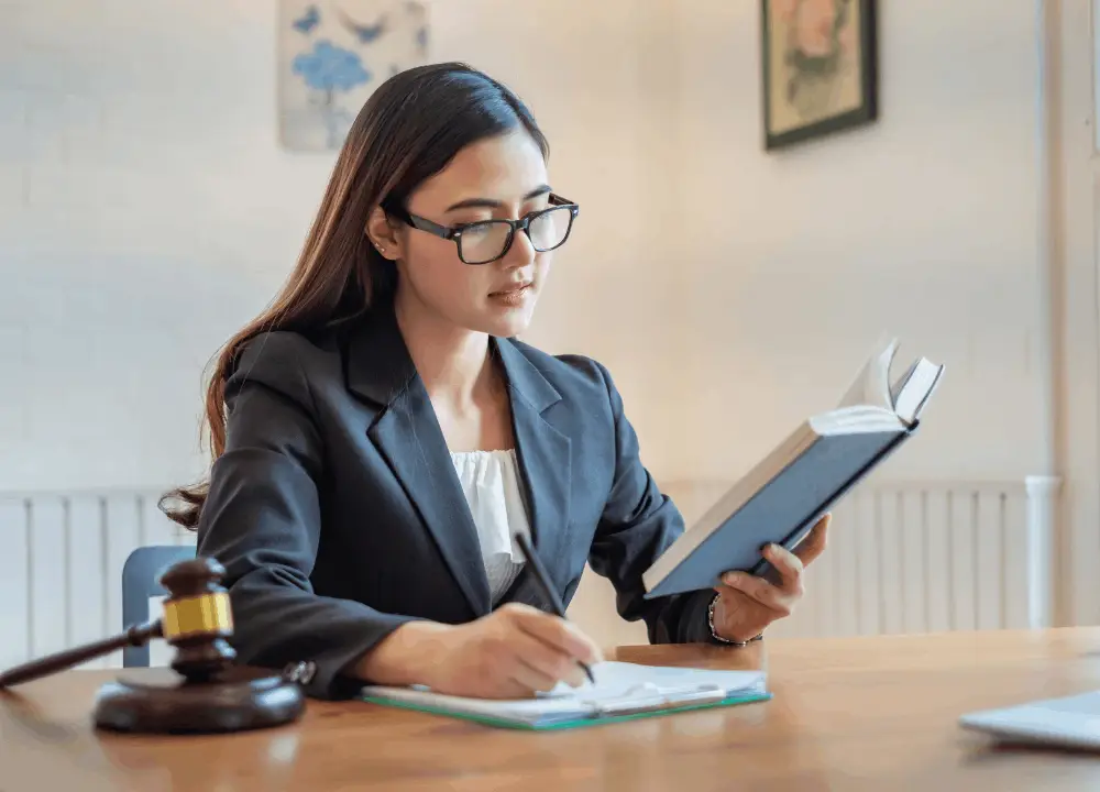 Identifying Asbestos: A Beginner's Guide to Household Sources 4 Lawyer reviewing asbestos exposure documents and compensation options