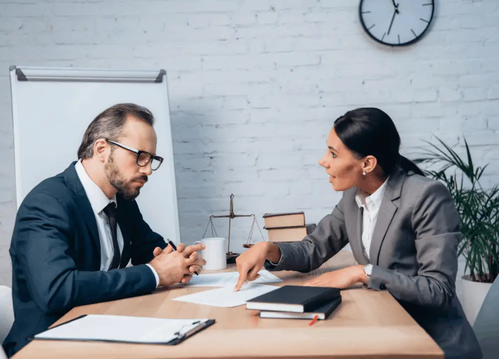 Compassionate asbestos attorney explaining legal options to a client