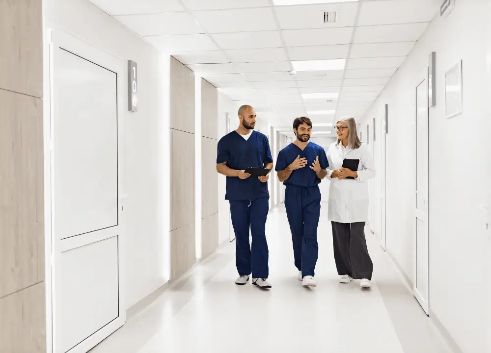 Life After Diagnosis: What the First 90 Days with Mesothelioma Really Look Like 1 Medical team walking together in a hospital specializing in cancer care