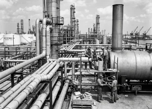 Industrial job site featuring high-temperature machinery and insulation common in Texas refineries and shipyards.
