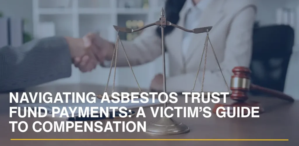 Scales of justice on a desk with a lawyer and client shaking hands in the background.