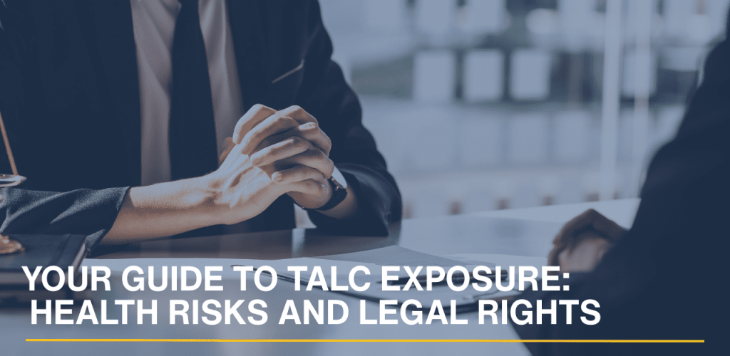 Lawyer consulting with a client while reviewing documents related to talc exposure and legal rights.
