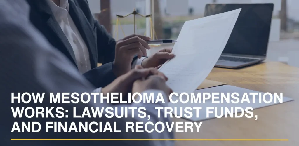 Lawyer reviewing compensation-related documents with a client during a legal consultation.