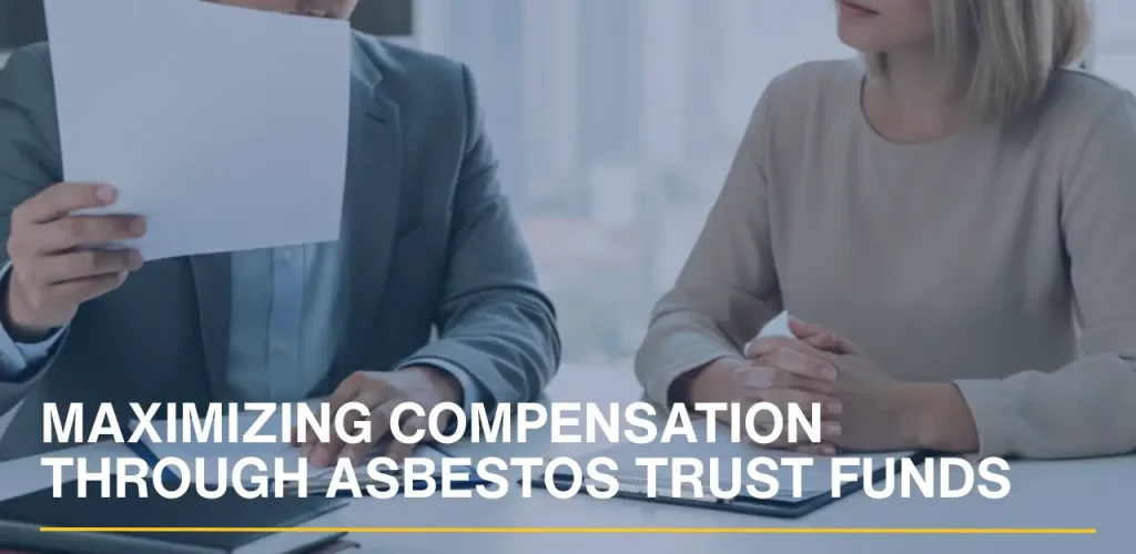 Attorney reviewing documents with a client to maximize asbestos trust fund compensation