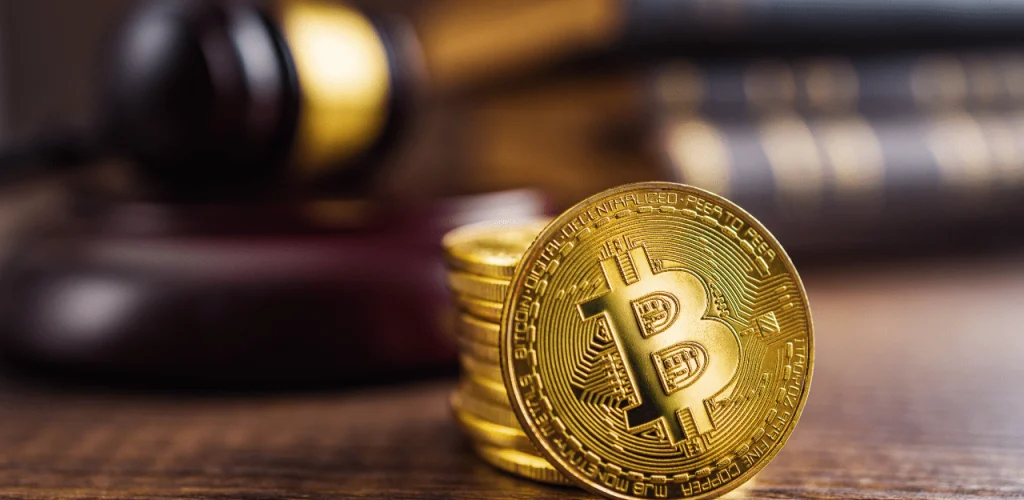 Gavel and bitcoin on legal document representing cryptocurrency recovery