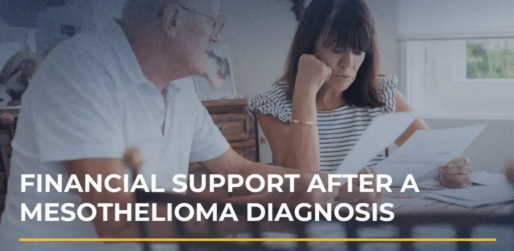 Patient and caregiver reviewing medical bills and paperwork after a mesothelioma diagnosis